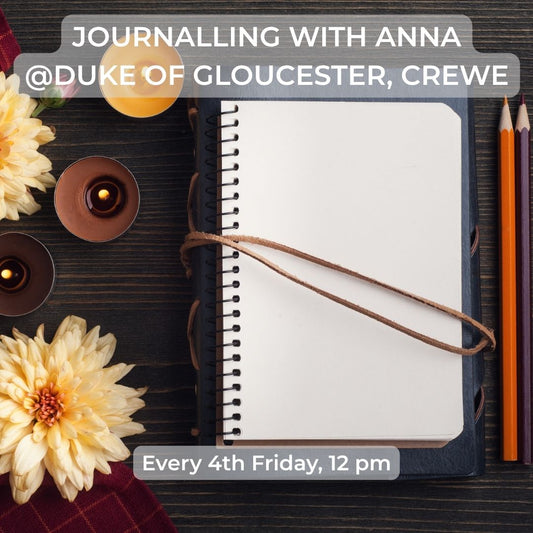 A styled flat-lay featuring a blank spiral-bound journal with a brown leather loop closure, surrounded by yellow flowers, tea lights, and colored pencils on a dark wooden surface. Text overlays read 'JOURNALLING WITH ANNA @DUKE OF GLOUCESTER, CREWE' at the top and 'Every 4th Friday, 12 pm' at the bottom.